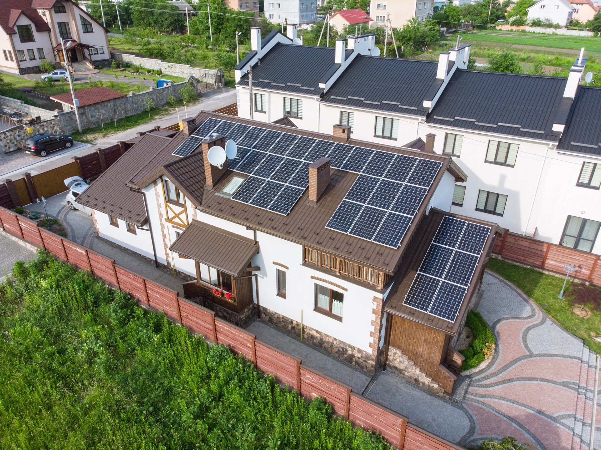 aerial view of house with solar roof. clean energy